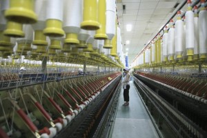 An employee works at a textile plant in Liaocheng